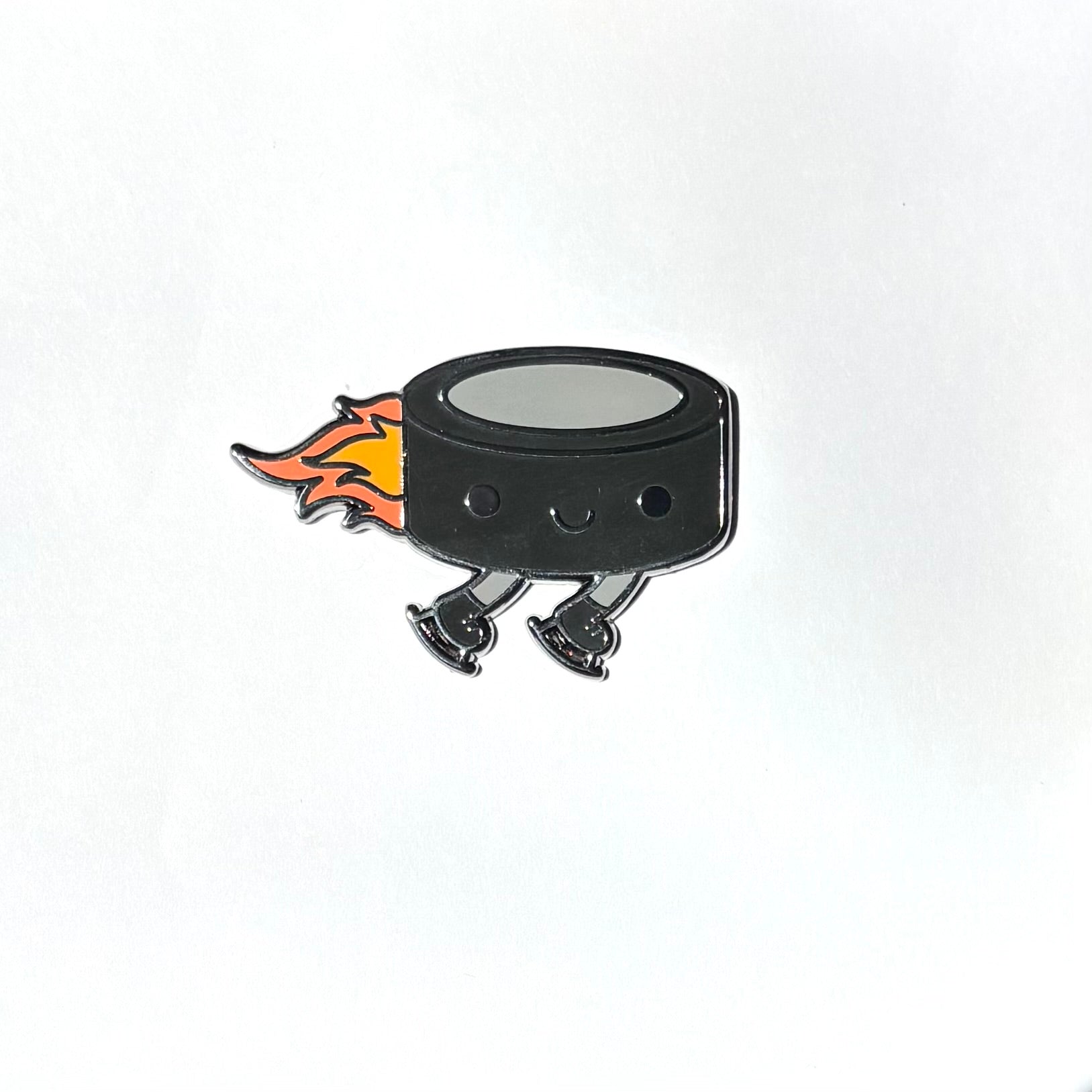 Flying Puck Enamel Pin